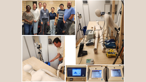 Researchers working with robots in the lab